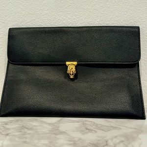 Alexander McQueen Black Envelope Clutch with gold skull.